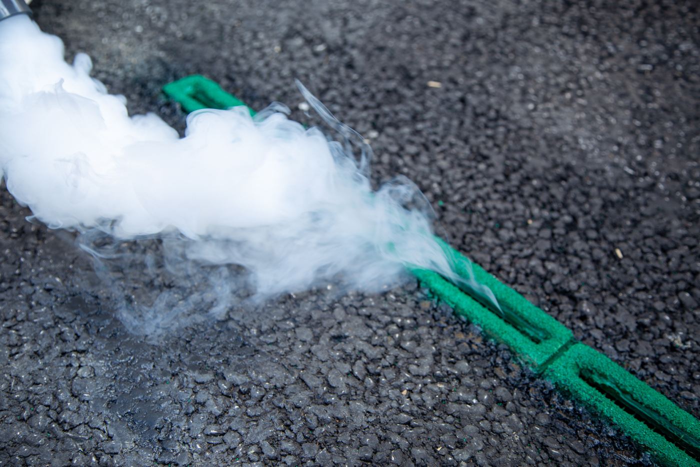 Close-up of exhaust being drawn into a Roadvent inlet in the road surface